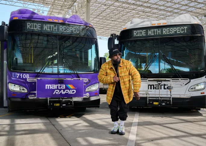 Big Boi poses with two MARTA buses.