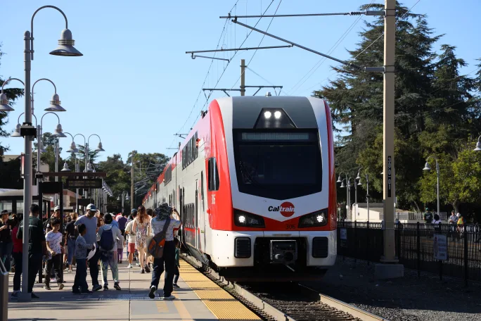 A Caltrain vehicle with passengers on opening day