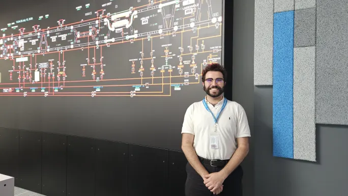 An intern in front of a DRPA/PATCO system map