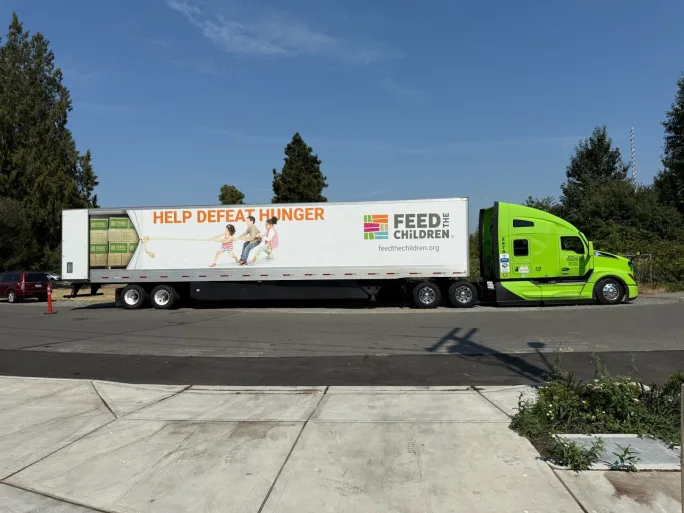 Green FTC truck pulling trailer