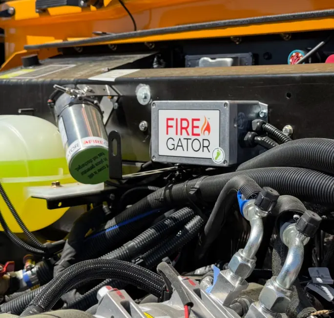 FireGator fire suppression system installed in the engine compartment of a school bus.