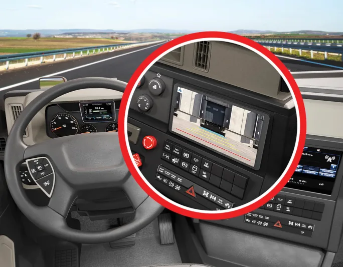 Inside of truck cab with close-up of backup camera screen on dash