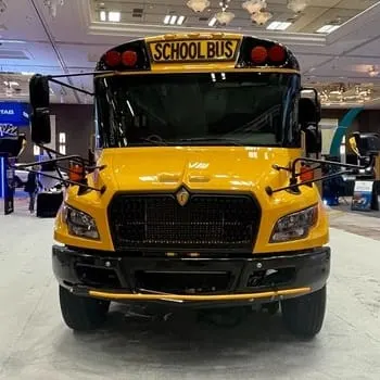 Front view of a yellow IC Bus CE Series gasoline school bus on display at the 2026 STN Expo.