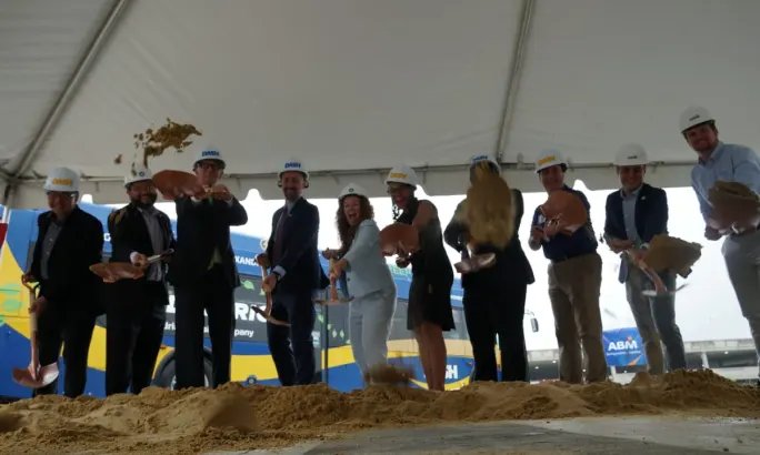 DASH employees and city partners break ground on electric bus chargers.