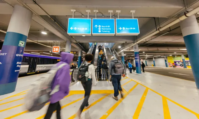 Riders walk through a WeGo Transit station.