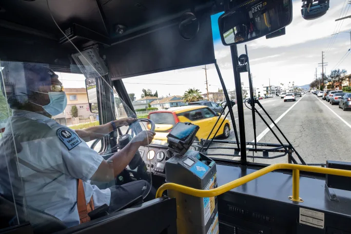 An LA Metro bus operator driving a bus.
