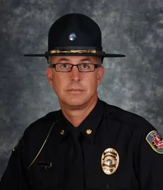Lance Evans in a state trooper uniform