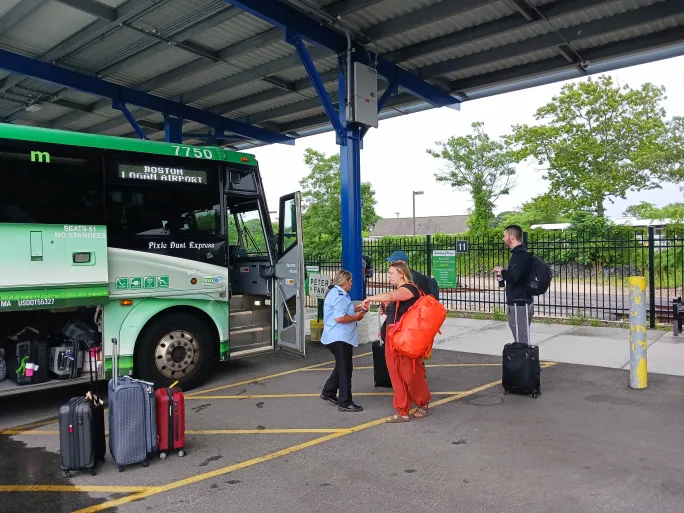 A Peter Pan Bus Lines bus with passengers.