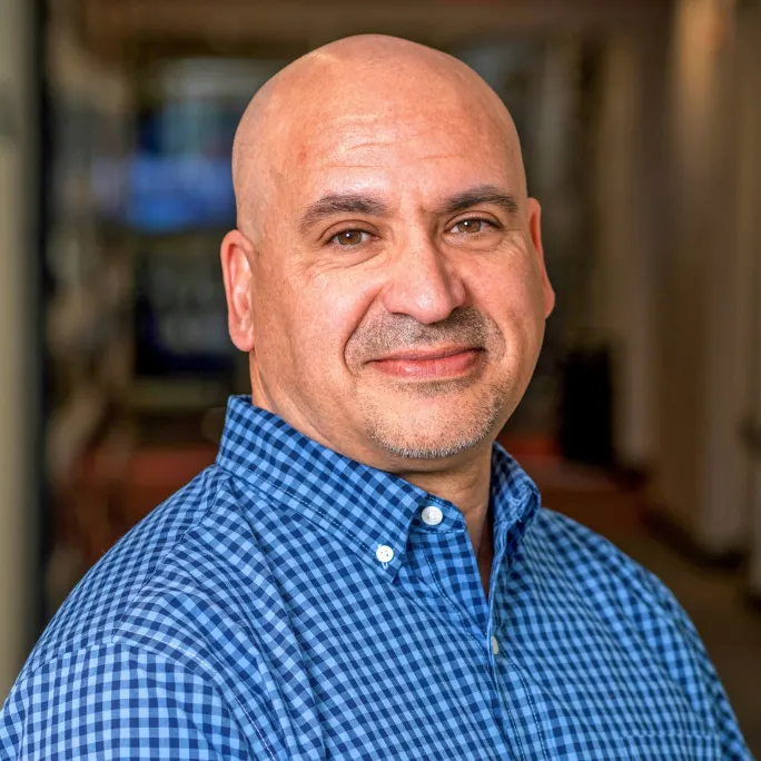 A professional portrait of Sal Fier.