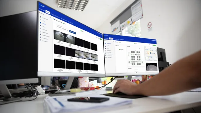 Two computer screens on desk