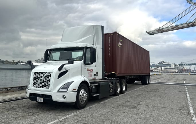Battery-electric Volvo truck pulling an intermodal container in a southern California port
