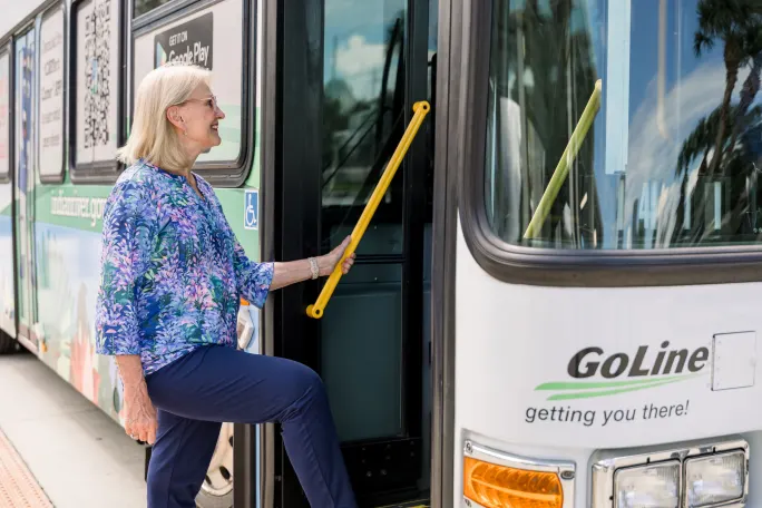 A customer boarding a GoLine bus