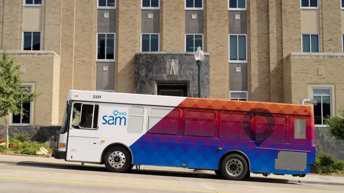 A photo of a SAM bus with Via branding
