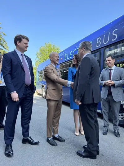 A group of people meeting and shaking hands.