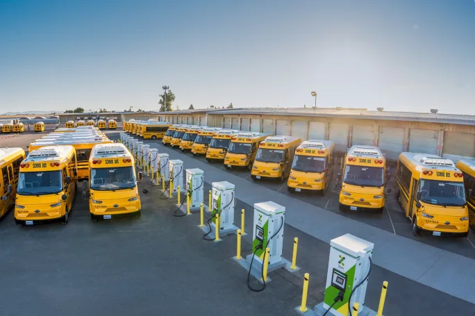 RIDE electric school buses in the lot at oakland's bus yard