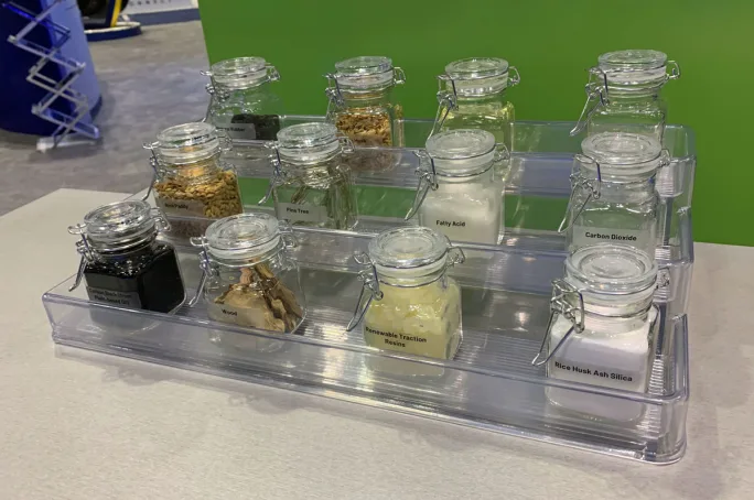 Jars holding samples of sustainable truck tire materials