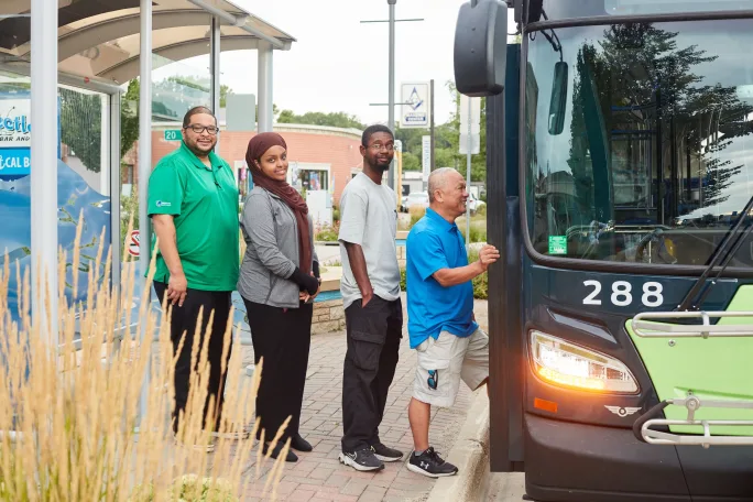 Customers queing to get on bus