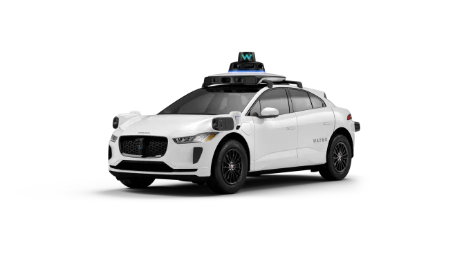 photo of a white Waymo vehicle
