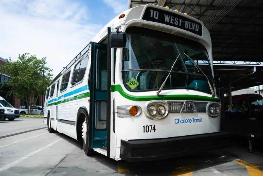 An preserved white and green older CATS transit bus.