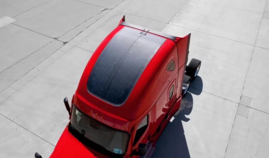 Solar panels on top of a red Class 8 truck sleeper cab