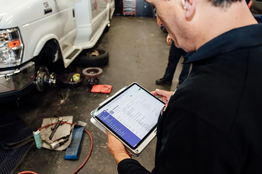 A maintenance person with a tablet.