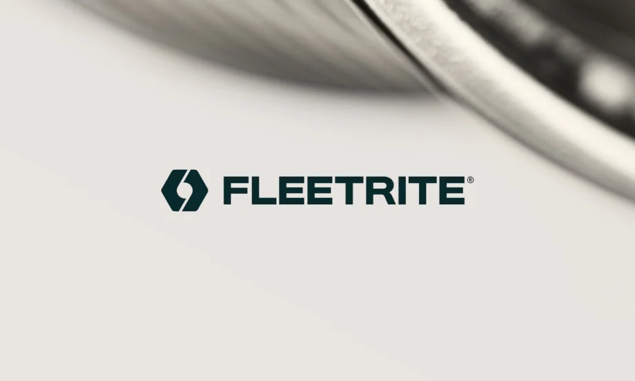 Fleetrite logo displayed against a light background with a blurred close-up of a vehicle in the upper right corner.
