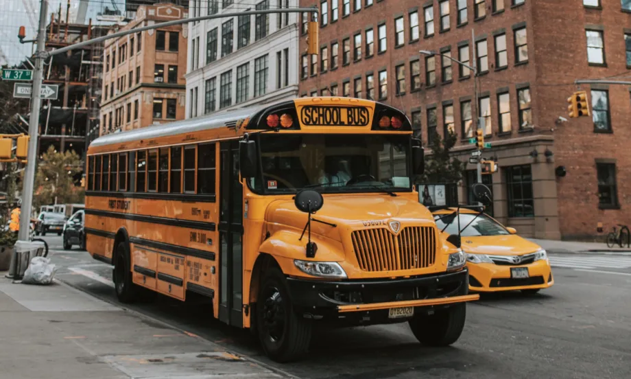 A New York school bus in the street.