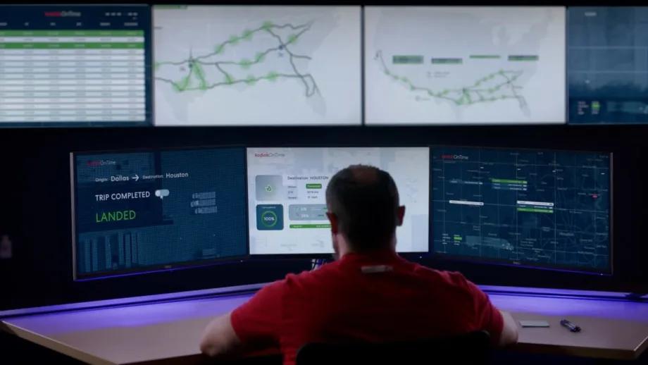 Man in front of multiple computer screens