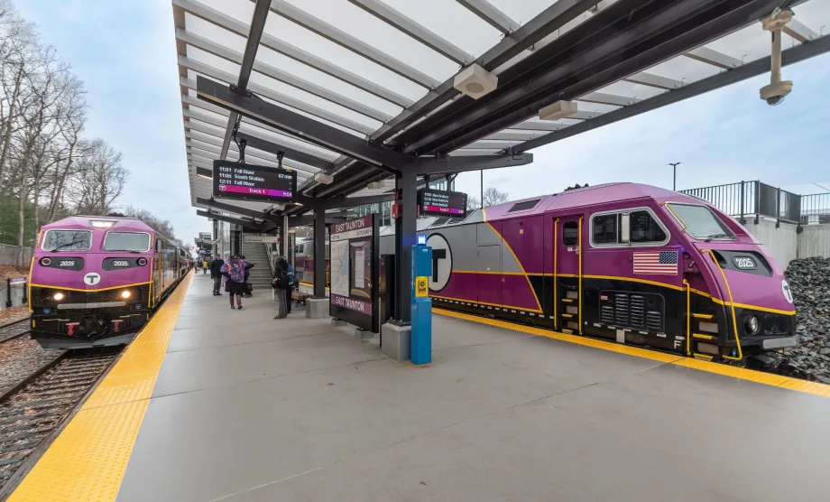 Two MBTA railcars in station.