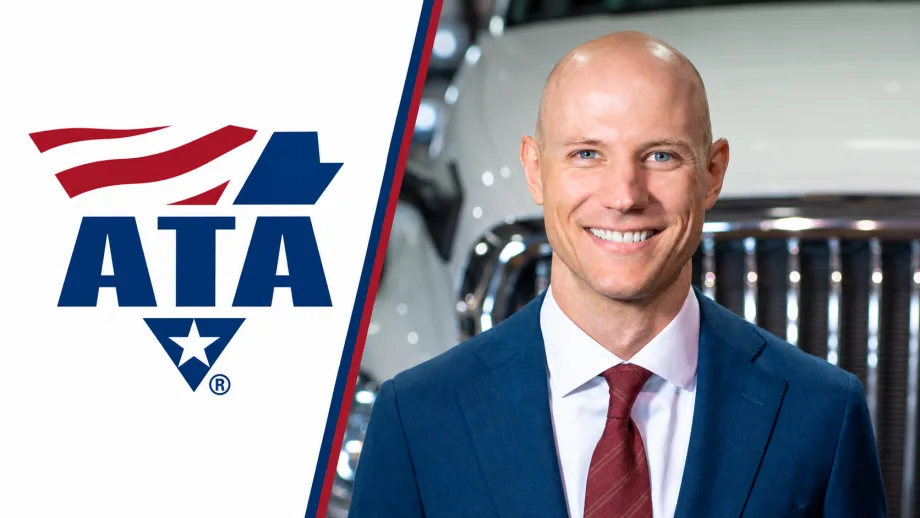 Headshot of Mark Colson in front of a truck grille next to an American Trucking Associations logo