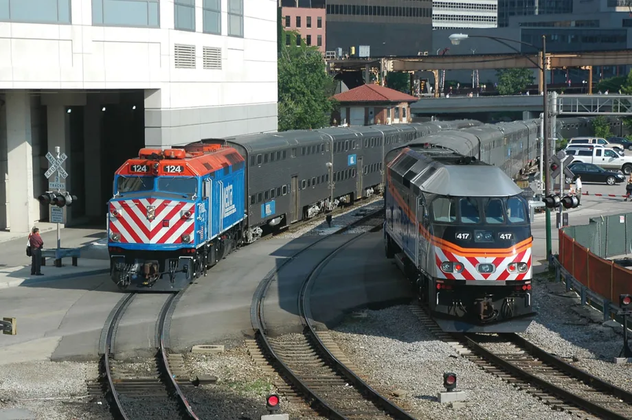 Two Metra locomotives on rail tracks.