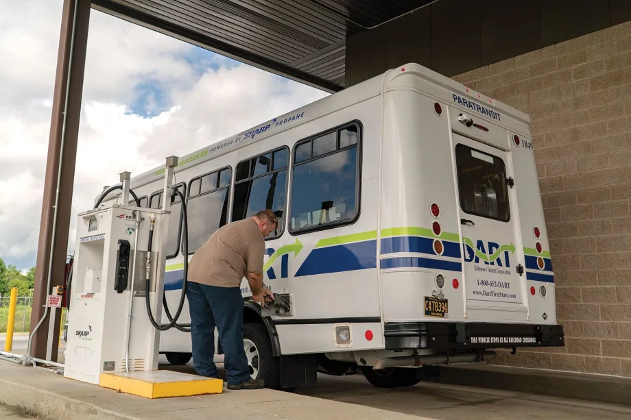 A paratransit vehicle being fueled