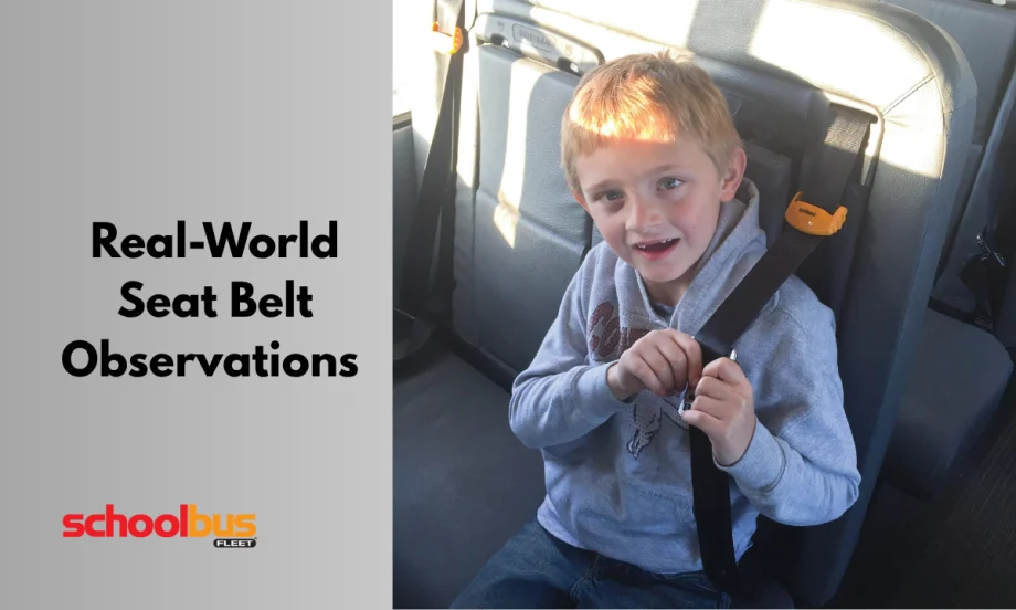 a child sits on a school bus seat wearing a seat belt