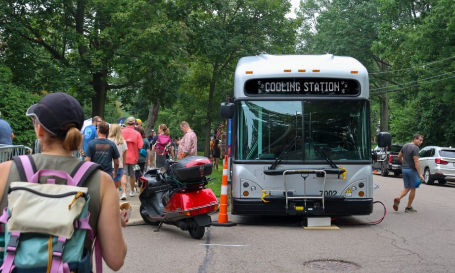 A bus that's powering the Beer Garden Stage and also serving as a Cooling & Charging Station for festival attendees.