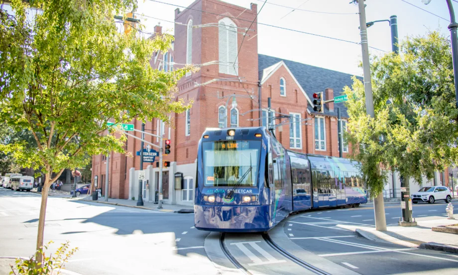 Blue A Line MARTA streetcar operating on the street.