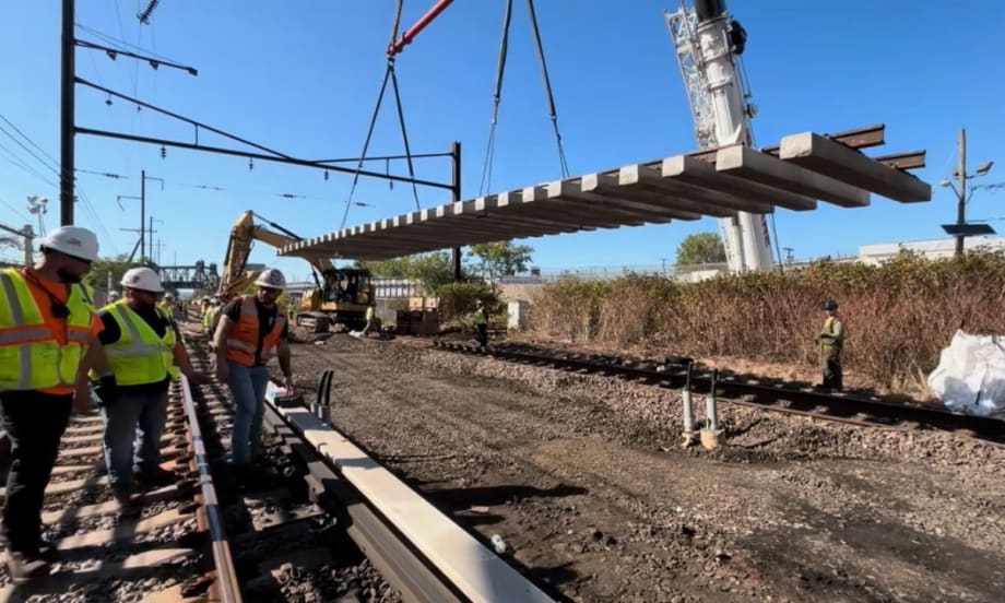 Image of construction workers working on a rail site.