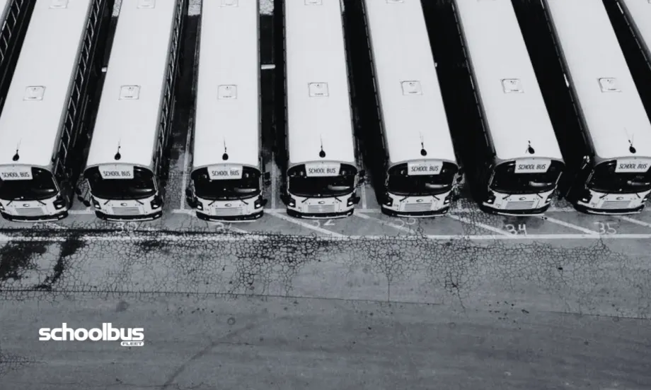 Black and white aerial view of a bus lot.