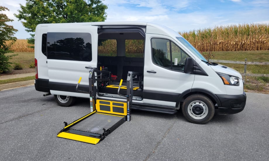 A white van with a chair lift conversion.