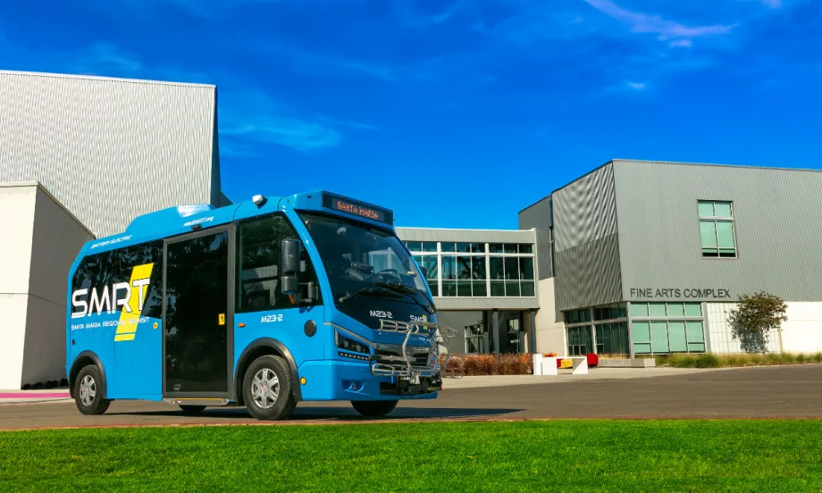 A blue SMRT Microtransit bus.