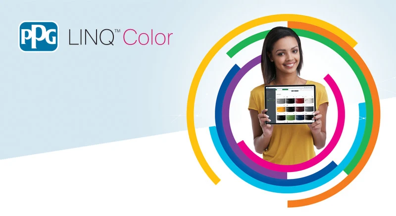 A woman holding a tablet with a screen showing rectangles of various colors